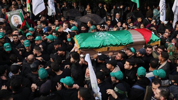 Mourners carry the coffin of Hamas' deputy leader, Saleh al-Aruri (portrait-R), killed on January 2 in a strike in Beirut's southern suburbs, during his funeral procession in Lebanon's capital on January 4. Lebanese authorities and Hamas accused Israel of killing Hamas leader al-Aruri and other officials, with Lebanese state media saying they died in a drone strike.  - Sputnik International