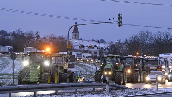 Farmers on their tractors cause a traffic jam as they protest against the federal government's austerity plans in Ludwigsburg, southern Germany on January 8, 2024.  - Sputnik International