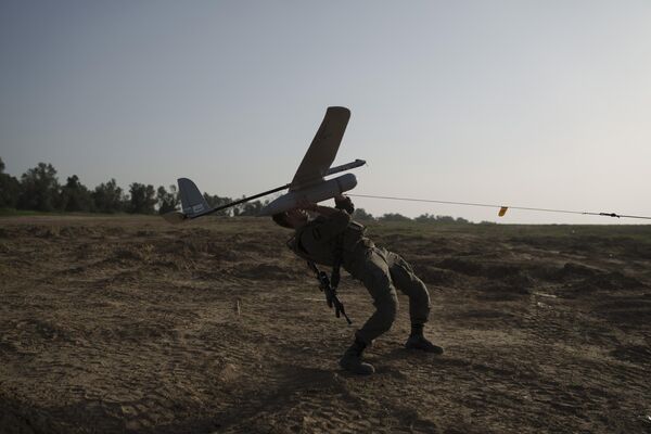 An Israeli soldier launches a drone near the Israeli-Gaza border in southern Israel, January 2024. - Sputnik International