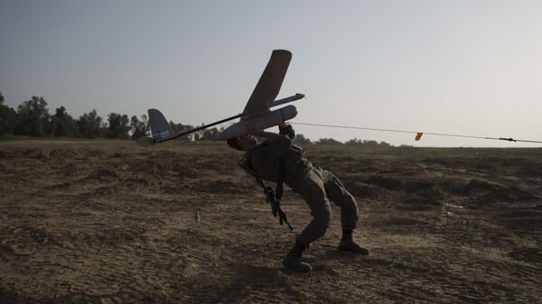 An Israeli soldier launches a drone near the Israeli-Gaza border in southern Israel, January 2024. - Sputnik International