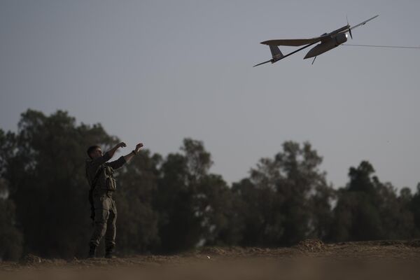 Israeli Defense Forces short-range reconnaissance drone takes flight after being launched by a trooper with the help of a rope line. - Sputnik International
