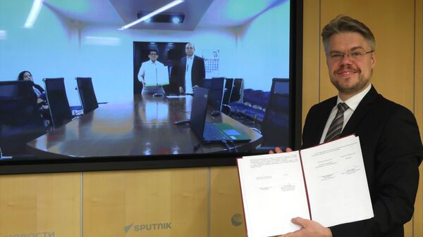 The memorandum was signed by Vasily Pushkov, Sputnik's International Cooperation Director, and Dr. Alberto R. Domingo, Jr., President of the New Era University (NEU). - Sputnik International