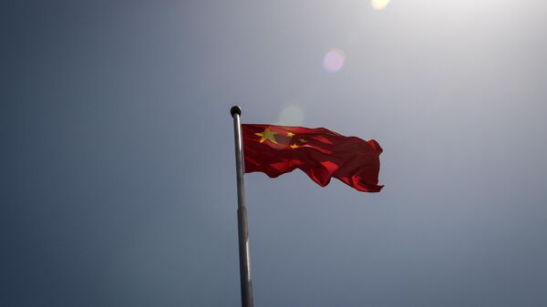 The Chinese national flag is seen at the entrance to the Zhongnanhai leadership compound in Beijing - Sputnik International