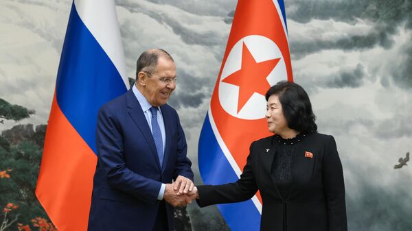 Russian Foreign Minister Sergey Lavrov, left, shakes hands with North Korean Foreign Minister Choe Son Hui during a meeting, in Pyongyang, North Korea.  - Sputnik International