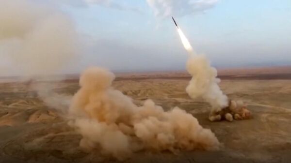 This frame grab from video shows the launching of underground ballistic missiles by the Iranian Revolutionary Guard during a military exercise, July 29, 2020. Iran's paramilitary guard launched underground ballistic missiles as part of an exercise involving a mock-up aircraft carrier in the Strait of Hormuz, state television reported Wednesday - Sputnik International