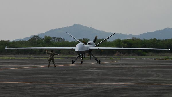 A US soldier guides the MQ-9 Reaper drone as it lands at Subic Bay Freeport Zone on April 23, 2023, as part of the US-Philippines joint military exercise ‘Balikatan’ - Sputnik International