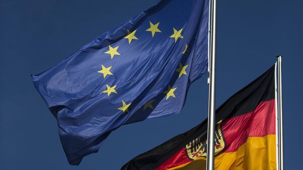 An European flag and a German flag wave in the wind in front of the chancellery Friday, Oct. 12, 2012 in Berlin. - Sputnik International