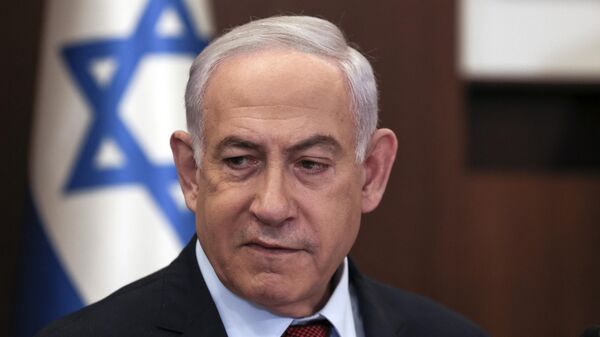 Israeli Prime Minister Benjamin Netanyahu heads the weekly cabinet meeting at his office in Jerusalem on December 10, 2023 - Sputnik International