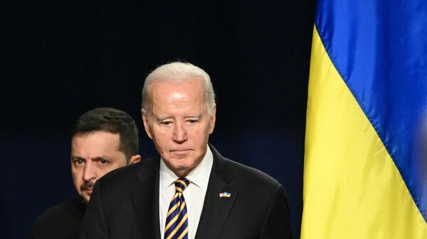 US President Joe Biden and Ukrainian President Volodymyr Zelensky arrive to hold a press conference at the White House in Washington, DC, December 12, 2023.  - Sputnik International