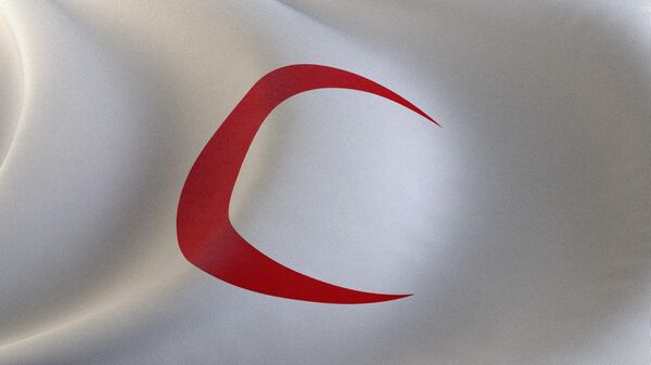 A flag with the symbol of Red Crescent, associated with the International Red Cross and Red Crescent Movement - Sputnik International