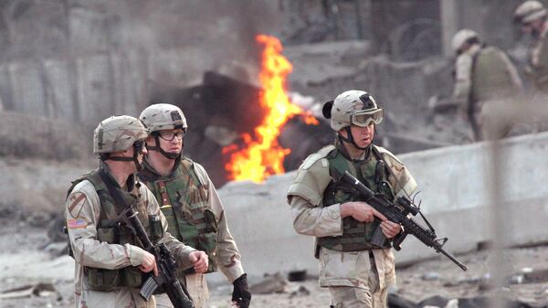 U.S. soldiers secure the site after an explosion in Baghdad, Wednesday, Jan. 19, 2005. A car bomb exploded near the Australian Embassy in central Baghdad on Wednesday, killing two people and wounding four, police and witnesses said. Australia said no embassy personnel were killed or hurt in the explosion - Sputnik International