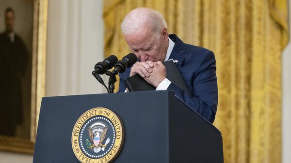 US President Joe Biden pauses as he listens to a question about the bombings at the Kabul airport that killed at least 12 U.S. service members, from the East Room of the White House, Thursday, Aug. 26, 2021, in Washington - Sputnik International