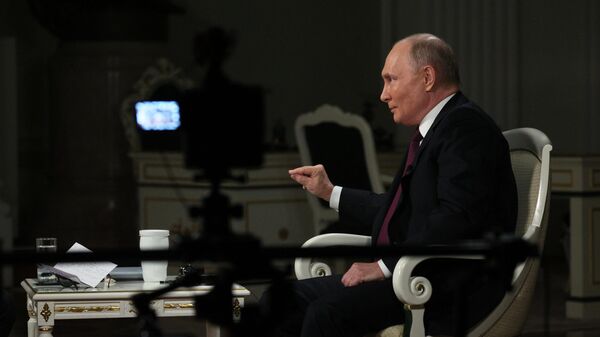 Russian President Vladimir Putin speaks during an interview with US journalist Tucker Carlson at the Kremlin in Moscow, Russia. - Sputnik International