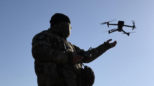  A Russian serviceman demonstrating drone capabilities during drills. File photo - Sputnik International