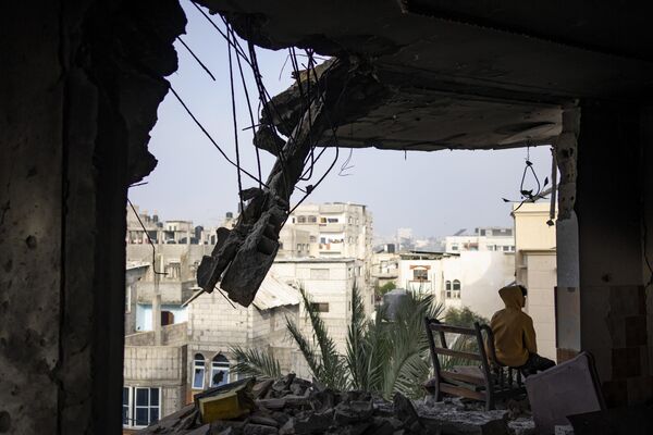 A Rafah resident sits in his house destroyed in the attack.  - Sputnik International