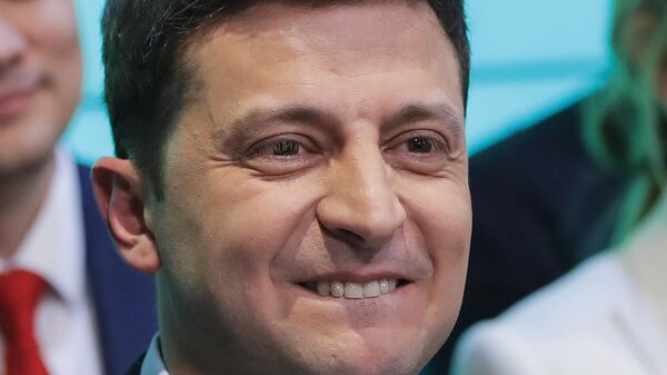 In this Sunday, April 21, 2019 file photo, Ukrainian comedian and presidential candidate Volodymyr Zelensky smiles after the second round of presidential elections in Kiev, Ukraine - Sputnik International