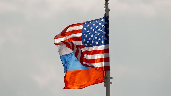 U.S. and Russian national flags wave on the wind before US Secretary of State Rex Tillerson arrival in Moscow's Vnukovo airport, Russia, Tuesday, April 11, 2017 - Sputnik International