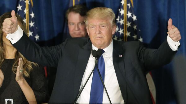Republican presidential candidate, businessman Donald Trump gives thumbs up to supporters during a primary night rally, Tuesday, Feb. 9, 2016, in Manchester, N.H. - Sputnik International