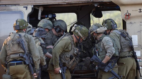 Israeli soldiers take part in a rescue exercise in Upper Galilee near the Lebanon border on February 7, 2024, amid ongoing battles between Israel and Palestinian Hamas militants in the Gaza Strip. - Sputnik International