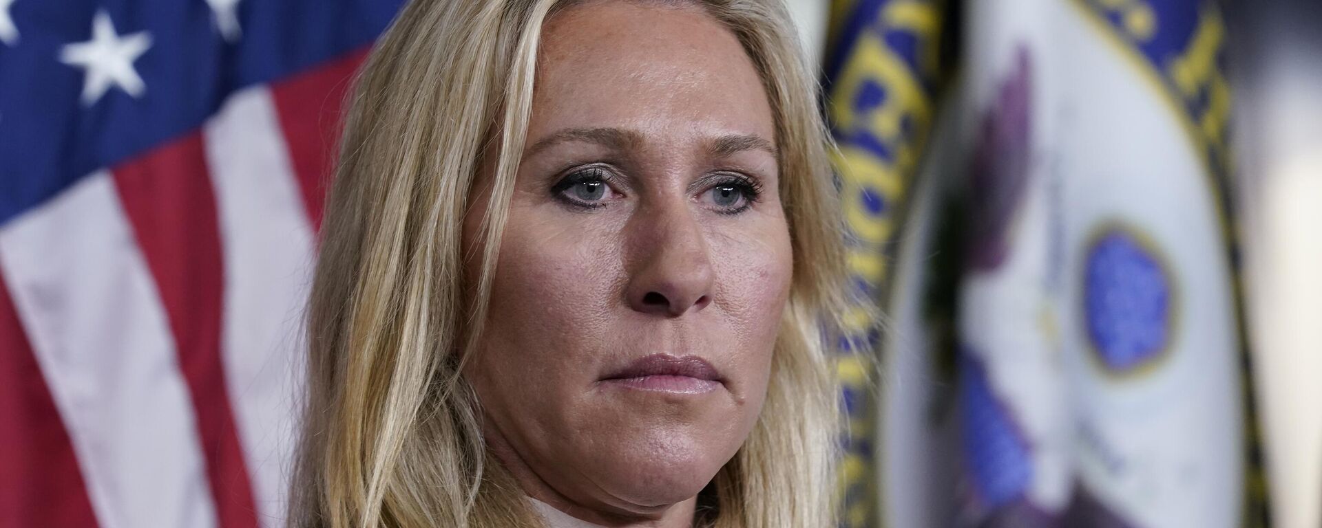 Rep. Marjorie Taylor Greene, R-Ga., listens during a news conference about the treatment of people being held in the District of Columbia jail who are charged with crimes in the Jan. 6 insurrection, at the Capitol in Washington, Tuesday, Dec. 7, 2021 - Sputnik International, 1920, 18.11.2025