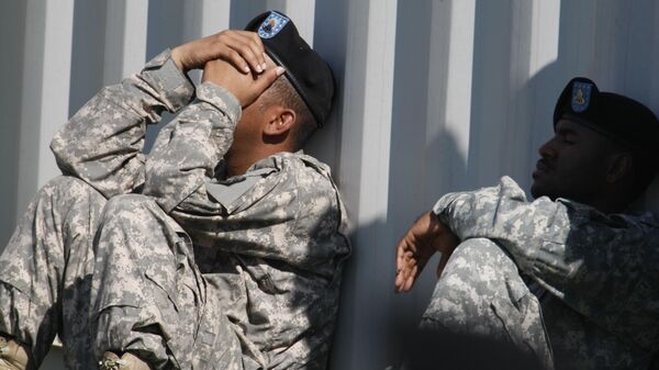 An unidentified army soldier looks emotional during a memorial service at Fort Hood, Texas, Tuesday, Nov. 10, 2009, where President Barack Obama spoke - Sputnik International