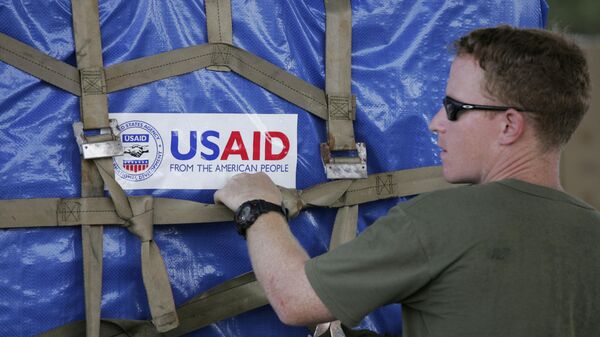 A U.S. marine packages USAID supplies bound for cyclone devastated Myanmar at the Utapao Air Force base near the southern city of Rayong, Thailand, Wednesday, May 14, 2008 - Sputnik International