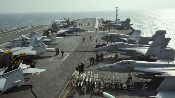 U.S. Navy Carrier Air Wing Five aircraft are tied down on the flight deck of the USS George Washington during a joint military exercise off South Korea's West Sea on Monday, Nov. 29, 2010 - Sputnik International