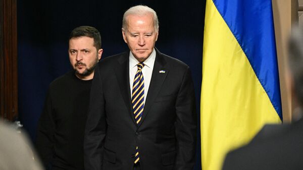 US President Joe Biden and Ukraine’s President Volodymyr Zelensky arrive to hold a joint press conference in the Indian Treaty Room of the Eisenhower Executive Office Building, next to the White House, in Washington, DC, on December 12, 2023. - Sputnik International