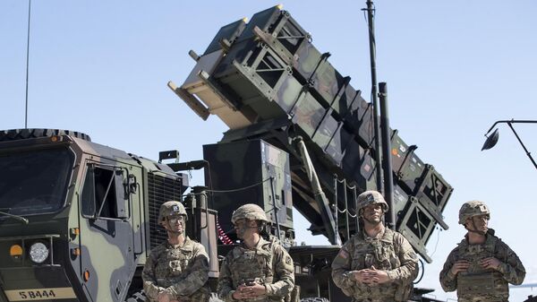 Members of US 10th Army Air and Missile Defense Command stands next to a Patriot surface-to-air missile battery. File photo - Sputnik International