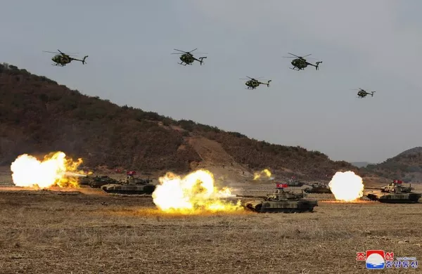 Tank units and helicopters are seen during the training competition. Photo: KCNA. 