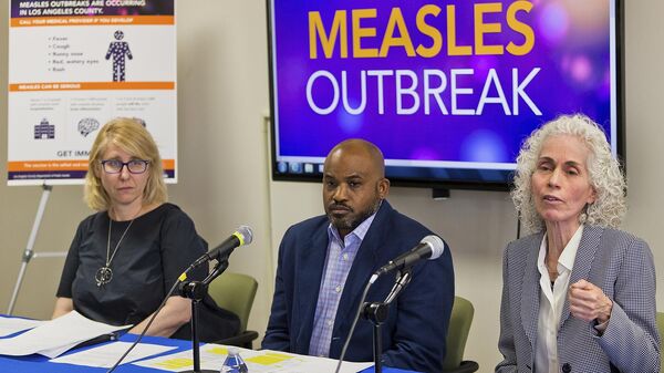 Los Angeles County Department of Public Health experts, from left, Dr. Sharon Balter, Director of Acute Communicable Disease Control, Muntu Davis, Health Officer, and Dr. Barbara Ferrer, Director, answer questions regarding the measles response and the quarantine orders in Los Angeles Friday, April 26, 2019 - Sputnik International
