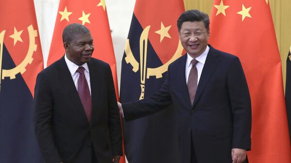 Angola's President Joao Lourenco, left, and Chinese President Xi Jinping prepare for their bilateral meeting at the Great Hall of the People in Beijing, Sunday, Sept. 2, 2018 - Sputnik International