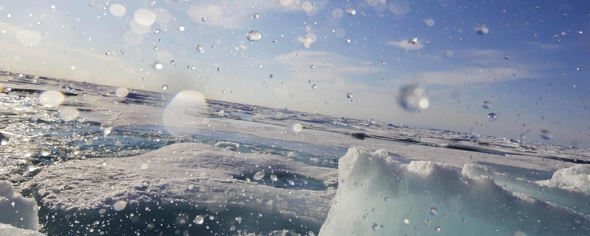 Water sprays as a block of sea ice is broken from the hull of the Finnish icebreaker MSV Nordica as it sails the Victoria Strait while traversing the Arctic's Northwest Passage, Friday, July 21, 2017 - Sputnik International, 1920, 13.02.2026