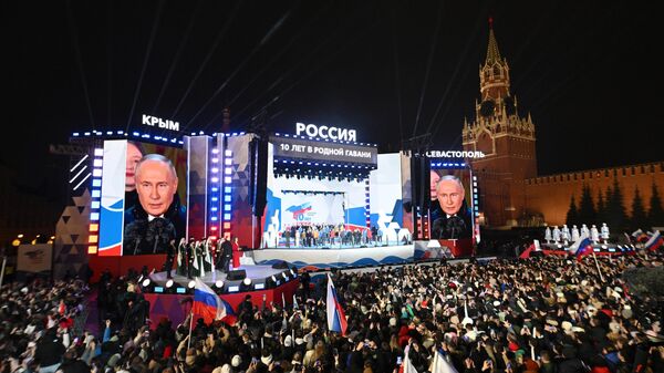 Russian President Vladimir Putin at a concert on Red Square in Moscow, dedicated to the 10th anniversary of Crimea's reunification with Russia.
 - Sputnik International