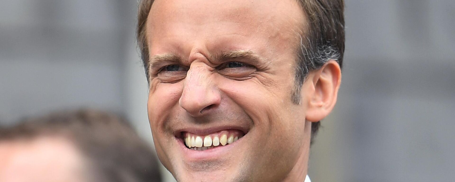 French President Emmanuel Macron grimaces on the town hall balcony on occasion of the Charlemagne Prize awarding in Aachen, Germany, Thursday, May 10, 2018 - Sputnik International, 1920, 29.04.2024