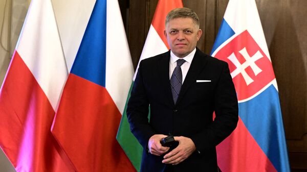 Slovakia's Prime Minister Robert Fico arrives for a family photo with Polish, Hungarian and Czech counterparts prior to the Visegrad Group (V4) meeting at the Government headquarter in Prague, Czech Republic, on February 27, 2024.  - Sputnik International