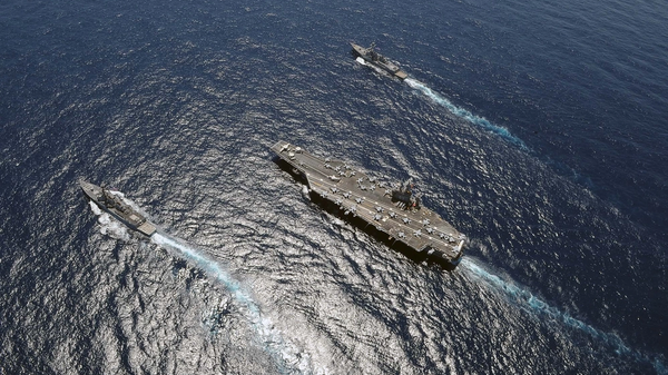 Guided-missile destroyers USS Jason Dunham (DDG 109) and USS Farragut (DDG 99) sail alongside Nimitz-class aircraft carrier USS Dwight D. Eisenhower (CVN 69). File photo. - Sputnik International