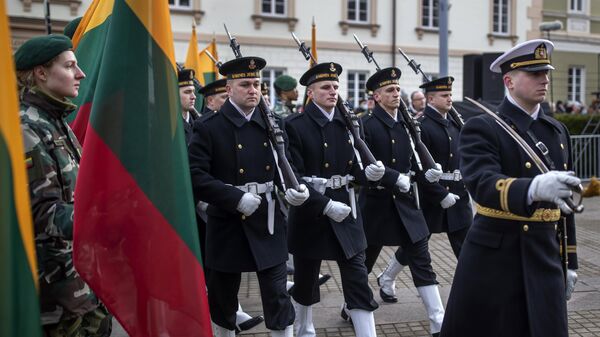Lithuanian soldiers march during a ceremony to mark State Restoration Day at the S. Daukanto Square, in front of the Presidential Palace in Vilnius, Lithuania, Wednesday, Feb. 16, 2022 - Sputnik International