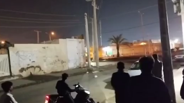 Screenshot from social media video showing the sounds of an attack on two police stations in Iran. - Sputnik International