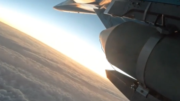 Screenshot of Defense Ministry video provided to Sputnik of a Su-34 carrying ODAB-500 bombs in the special operation zone. - Sputnik International