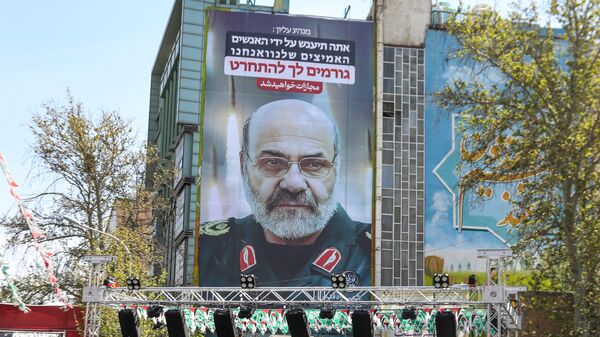 A billboard displays a portrait of slain Iran's Brigadier General Mohammad Reza Zahedi with a slogan in Hebrew saying, You will be punished, on April 3, 2024 at Palestine Square in Tehran, after he was killed in a strike at the consular annex of the Iranian embassy in Damascus.  - Sputnik International