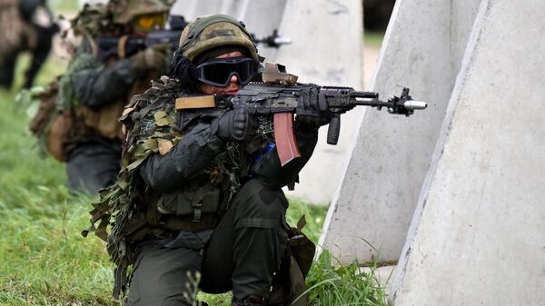 Servicemen attend the Rapid Trident 2021 military drills at the combat training ground outside the town of Yavorov, Lvov region, Western Ukraine. - Sputnik International