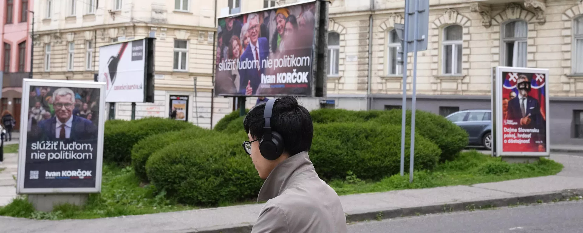 A man stands by posters for former Foreign Minister Ivan Korcok, a pro-Western career diplomat, and Peter Pellegrini, right, who currently serves as Parliament's speaker, two of the nine candidates in the upcoming Slovakia's presidential election, in Bratislava, Slovakia, Friday, March 22, 2024. (AP Photo/Petr David Josek) A man stands by posters for former Foreign Minister Ivan Korcok, a pro-Western career diplomat, and Peter Pellegrini, right, who currently serves as Parliament's speaker, two of the nine candidates in the upcoming Slovakia's presidential election, in Bratislava, Slovakia, Friday, March 22, 2024. (AP Photo/Petr David Josek) - Sputnik International, 1920, 06.04.2024