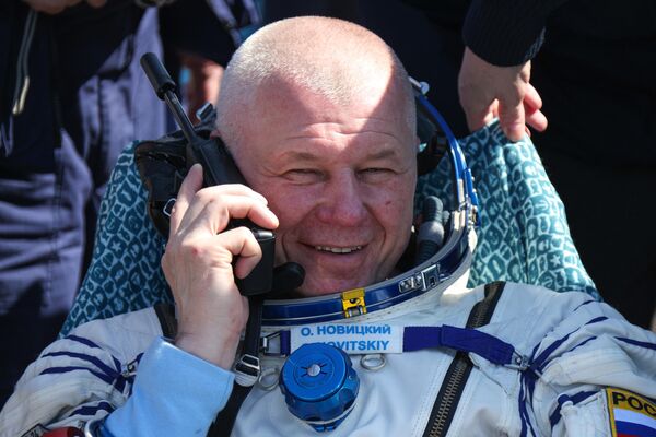 Russian cosmonaut Oleg Novitsky at the descent vehicle of the Soyuz MS-24 spacecraft. - Sputnik International