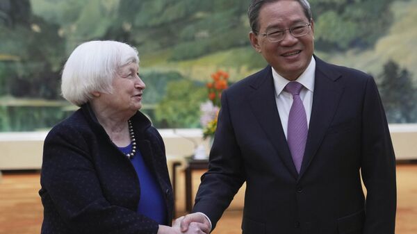 U.S. Treasury Secretary Janet Yellen, left, shakes hands with Chinese Premier Li Qiang at the Great Hall of the People in Beijing, China, Sunday, April 7, 2024. Yellen, who arrived later in Beijing after starting her five-day visit in one of China's major industrial and export hubs, said the talks would create a structure to hear each other's views and try to address American concerns about manufacturing overcapacity in China. - Sputnik International