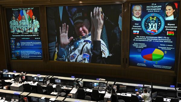 Russian cosmonaut Oleg Novitsky appears on a screen during a live broadcast of the landing of the Soyuz MS-24 spacecraft with the crew returned to Earth from the International Space Station (ISS), at the Mission Control Centre of Roscosmos in Korolyov, Moscow region, Russia - Sputnik International