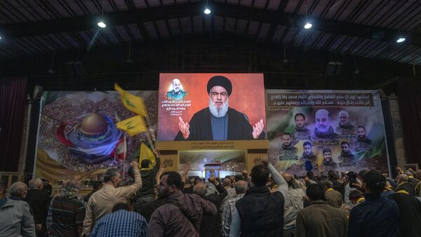 Hezbollah leader Sayyed Hassan Nasrallah speaks in a televised address via a video link during a ceremony to commemorate the death of the Iranian Revolutionary Guard Gen. Mohammad Reza Zahedi, and six officers, who were killed by an Israeli airstrike - Sputnik International