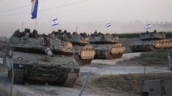 Israeli tanks head towards the Gaza Strip border in southern Israel on Thursday, Oct.12, 2023 - Sputnik International