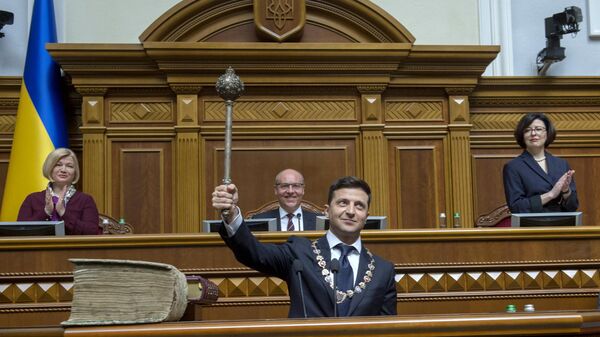 Ukraine's President Volodymyr Zelensky holds the Bulava, the Ukrainian symbol of power, during his inauguration ceremony at the parliament in Kiev on May 20, 2019.  - Sputnik International