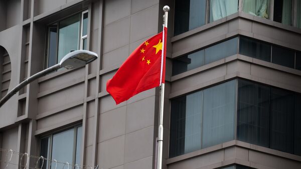 The Chinese flag waves outside of the Chinese consulate in Houston after the US State Department ordered China to close the consulate in Houston, Texas, the United States - Sputnik International